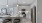 view into kitchen with stainless appliances and barstools